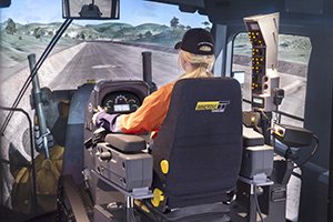 Immersive Technologies’ new simulator module includes a complete replica cab of the Caterpillar 24M Motor Grader, with fully functional controls and instrumentation sourced directly from Caterpillar. The combination dash mounted instrument cluster and the CAT Advisor Messaging System provide key machine operating information and give the operator insight into the machine’s operation and maintenance needs.  